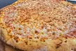Crave-Worthy Combos - Choice of Appetizers, Large Salad, 14'' or 16'' Specialty Pizza, & More (Up To 36% Off) - Second Medium