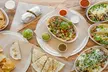Customizable Burritos, Bowls, or Tacos with Chips, Dip & Drinks for One, Two, or Four People (Up to 36% Off) - Second Medium
