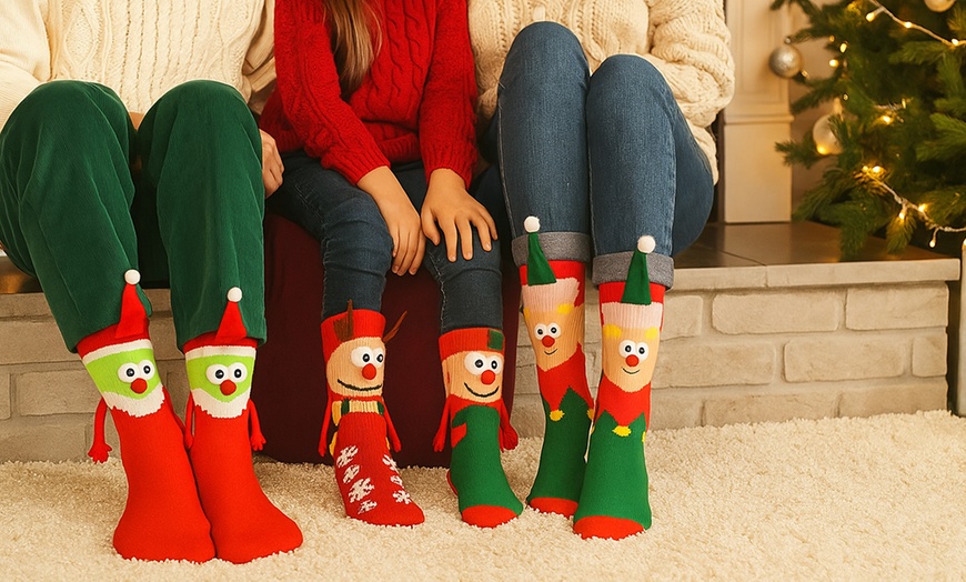 Image 1: Pack of Four Magnetic Hand-Holding 3D Christmas Socks