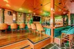 Savor & Sip Caribbean Cuisine: One, Two, or Four Drinks and Appetizers in a Cozy Atmosphere (Up To 35% Off) - Second Medium