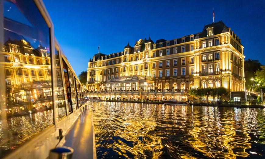 Image 35: Grachten vol lichtjes en legendes: een avondcruise door Amsterdam