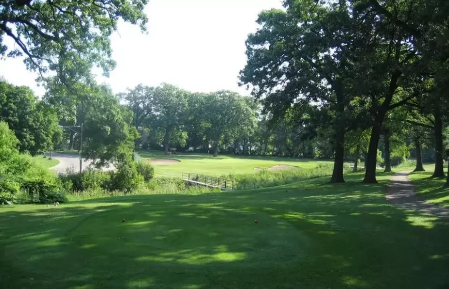 Experience Serene Tree-Lined Fairways on an 18-Hole Course!