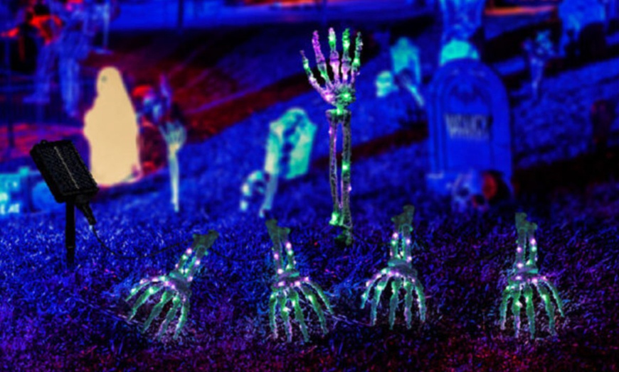 Image 5: Five-Pack Halloween Solar Skull Hand Ground Lights