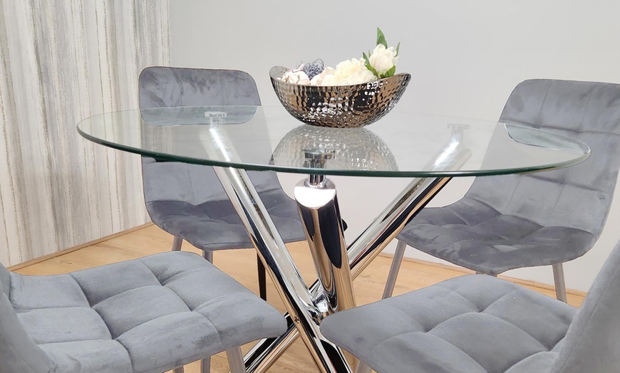 Image 2: Round Clear Glass Dining Table with Chrome Legs and Four Velvet Chairs