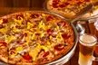 Two or Four Movie Tickets Packages with Popcorn, Pizza and More at Aloma Cinema Grill (Up To 27% Off) - Second Medium
