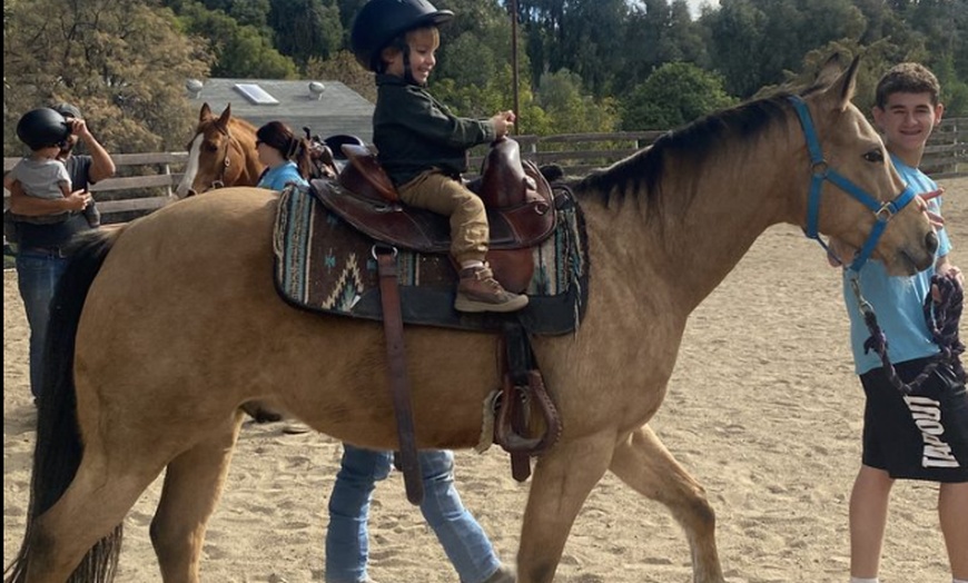 Image 2: Horse riding and animal time at a private ranch. Family Experience, Mommy & Me, or Ranch Camp. All ages. Valid Mon-Fri