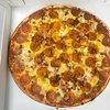 Image 1: Pizza Deals with Appetizer, Garlic Bread, or Dining Credit Options