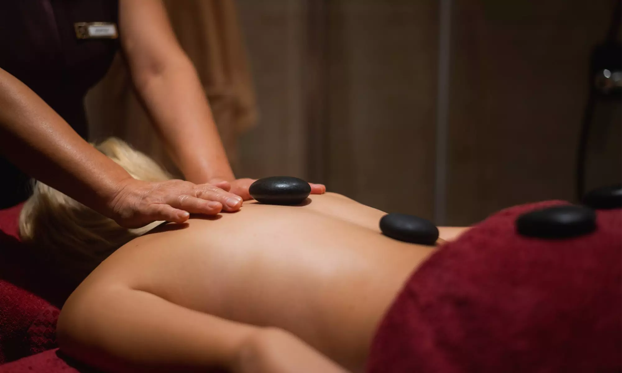 60-Min Hot Stone or Deep Tissue Massage w/ Optional 15-Min Foot Scrub