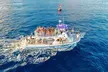 See and listen to humpback whales on a 2-hour Waikiki cruise with live hula, local treats, and a free return guarantee! - Second Medium