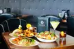 One entree or cocktail for each person and 90 or 60 minutes of golf simulator time for two or four - Second Medium