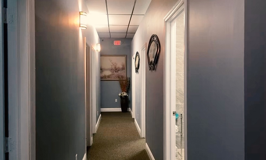 Image 7: Deep Tissue Hot Stone Massage with Walk-On-Back for One or Couples