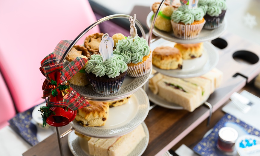 Image 4: The Snowman Afternoon Tea Bus Tour in London, Perfect Christmas Gift!