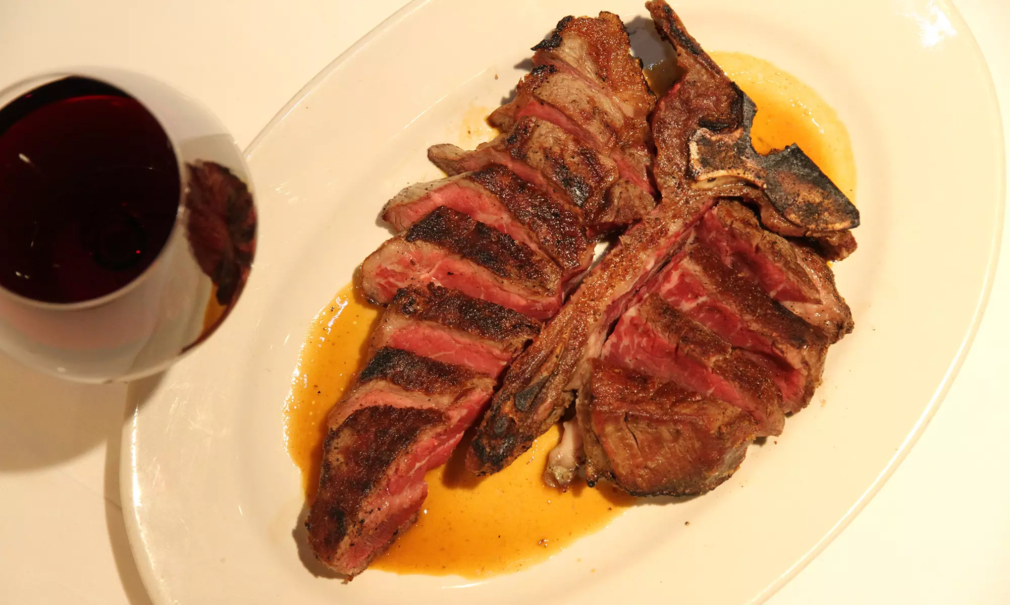 Indulge in a Three-Course Dinner: One Appetizer, One Entree and One Dessert and a Bottle of Wine. Save Up to 57% - Second Medium
