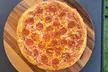 Crave-Worthy Combos - Choice of Appetizers, Large Salad, 14'' or 16'' Specialty Pizza, & More (Up To 36% Off) - Second Medium