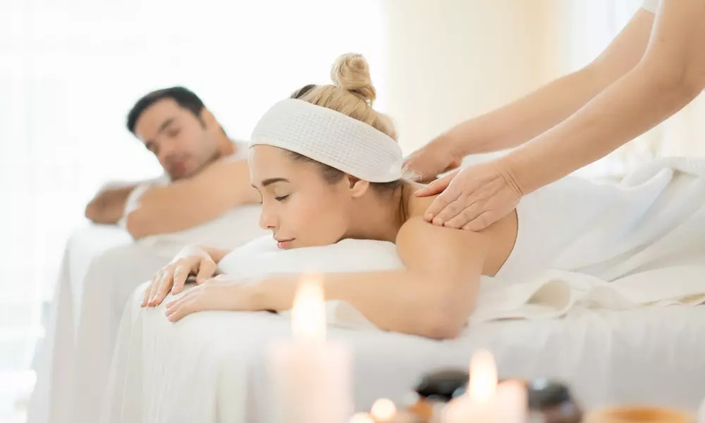 50-Min Therapeutic Massage + Hot Stones for 1 or Couples or 60-Min Custom Combo Massage (Up to 50% Off)