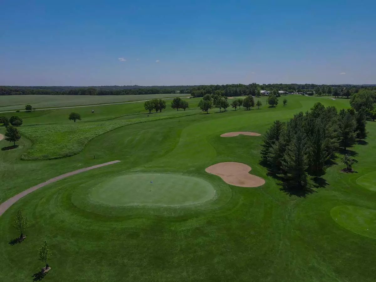 Experience 18 Holes Golf with Cart, Range Balls, and Scenic Elevation