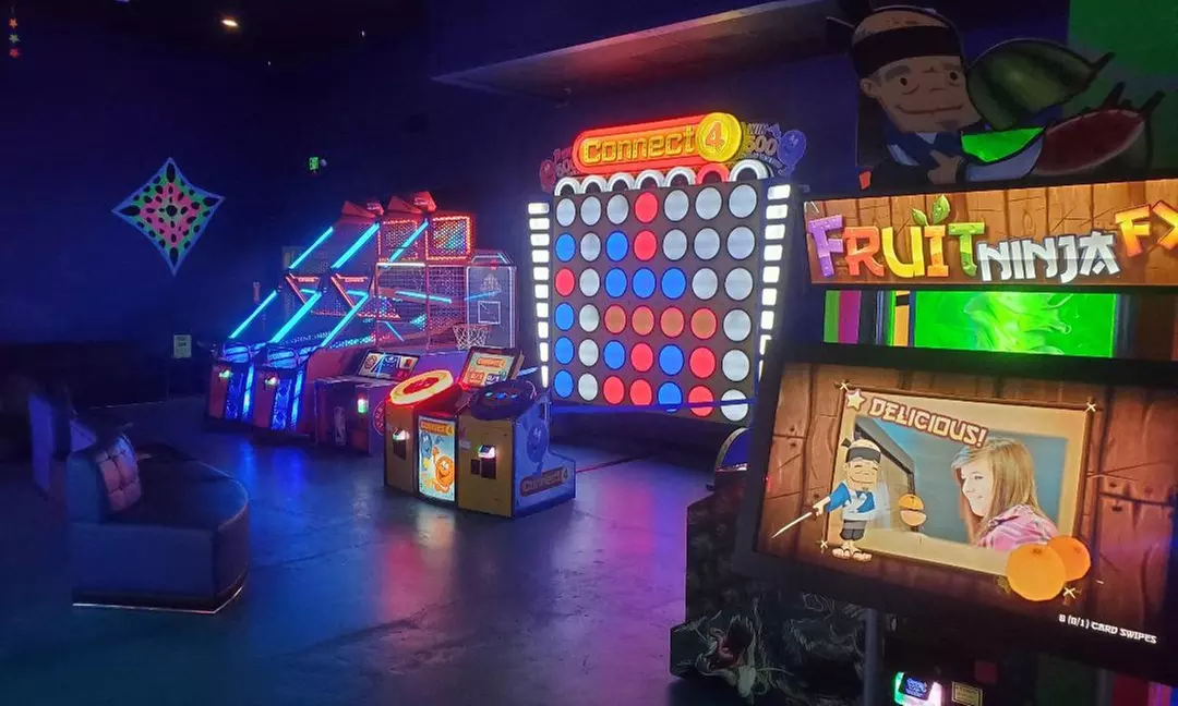 Light Up the Fun with Blacklight Minigolf Rounds and Arcade Games!