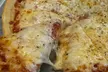 12" or 16" Thin Crust Pizza with One Topping & Dough Dippers at Travinos Pizza Up To  46% Off - Second Medium