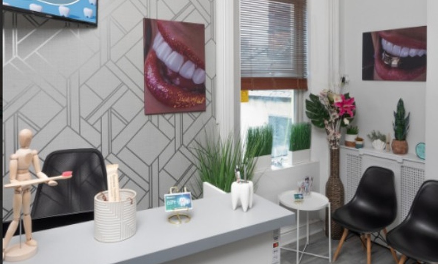 Image 2: Scale and Polish with a Choice of Laser Teeth Whitening at Denticare