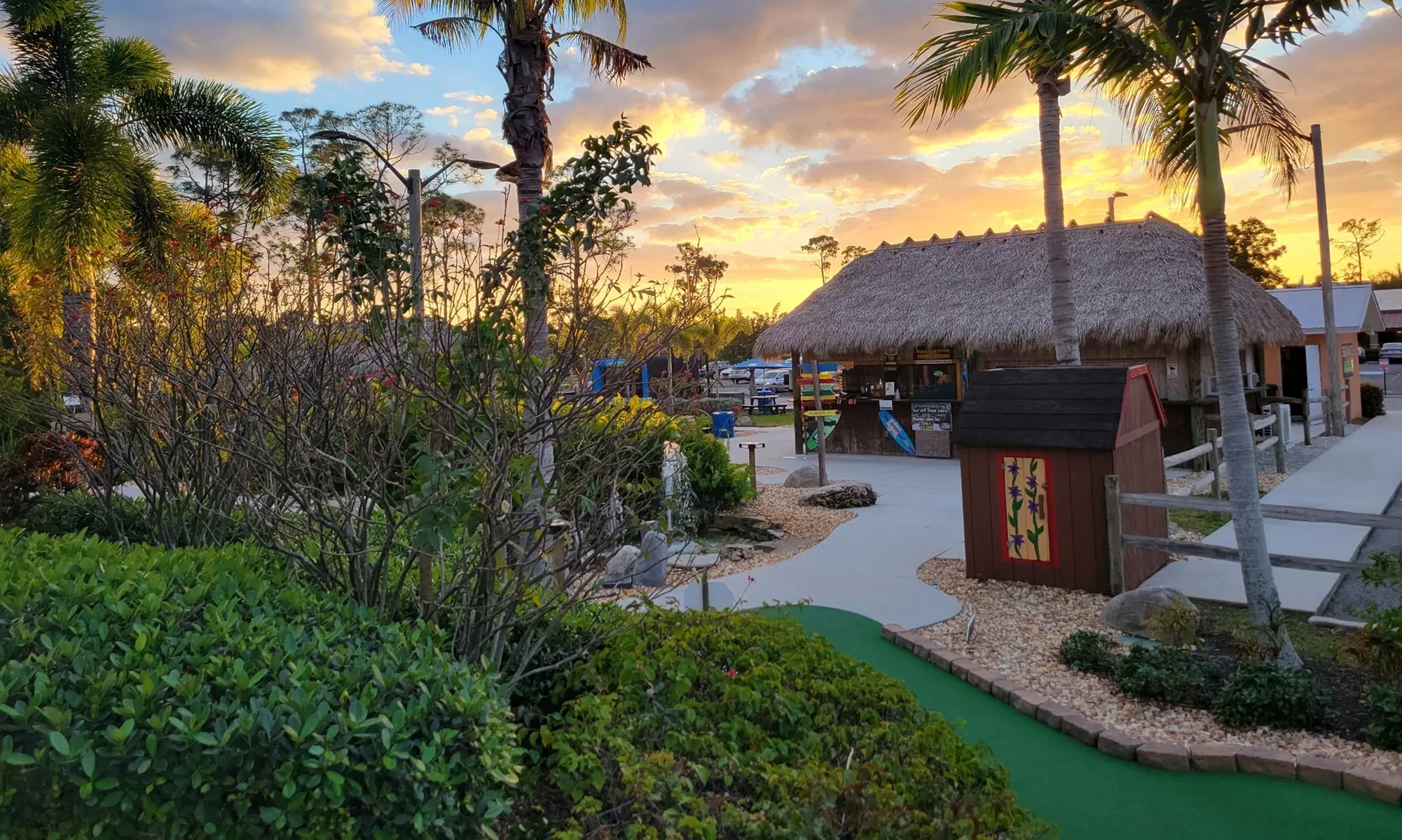 Experience Challenging Miniature Golf with Cascading Waterfalls at Tropical Breeze Fun Park