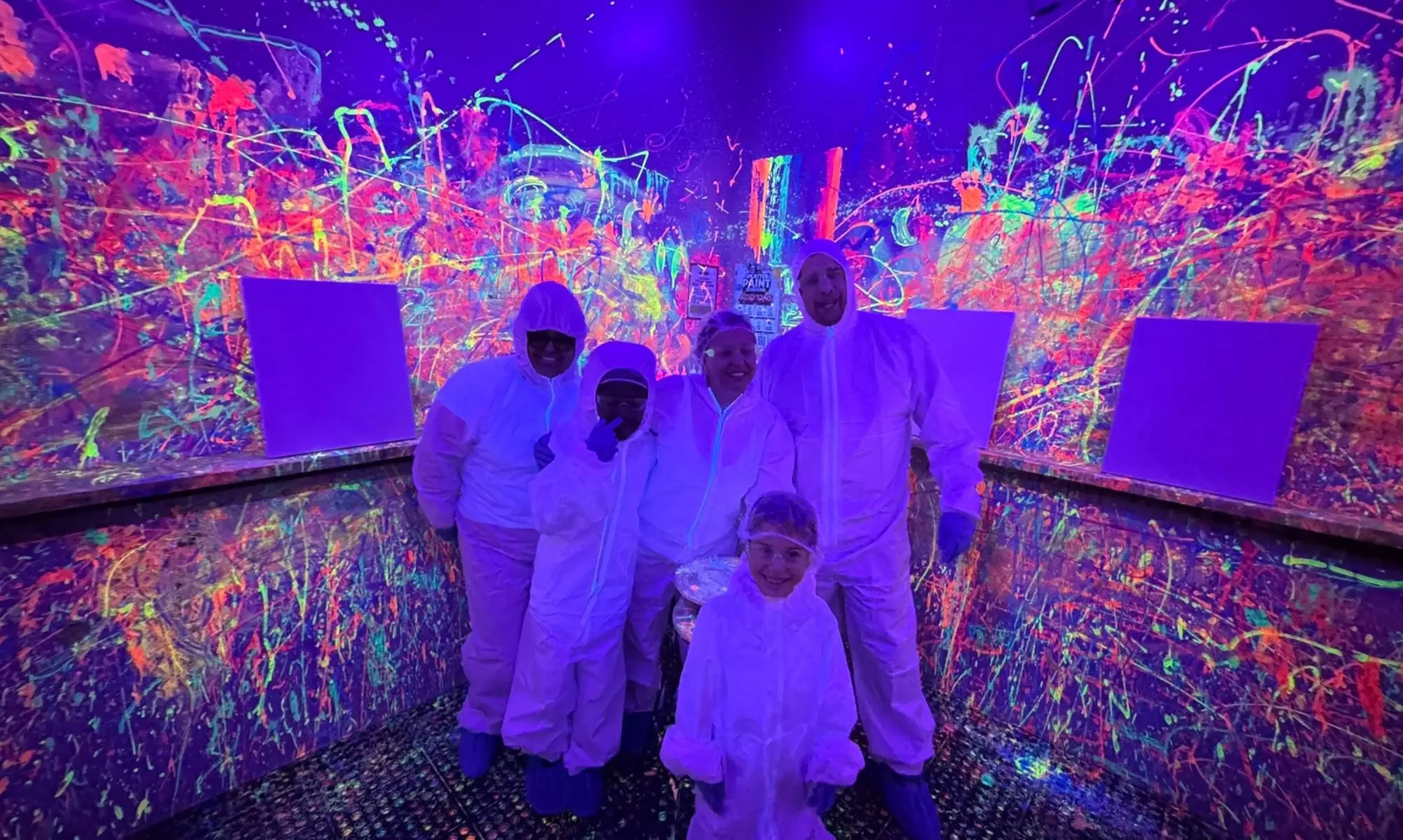 Blacklight Paint Splatter Session with Take-Home Canvas at iSmash