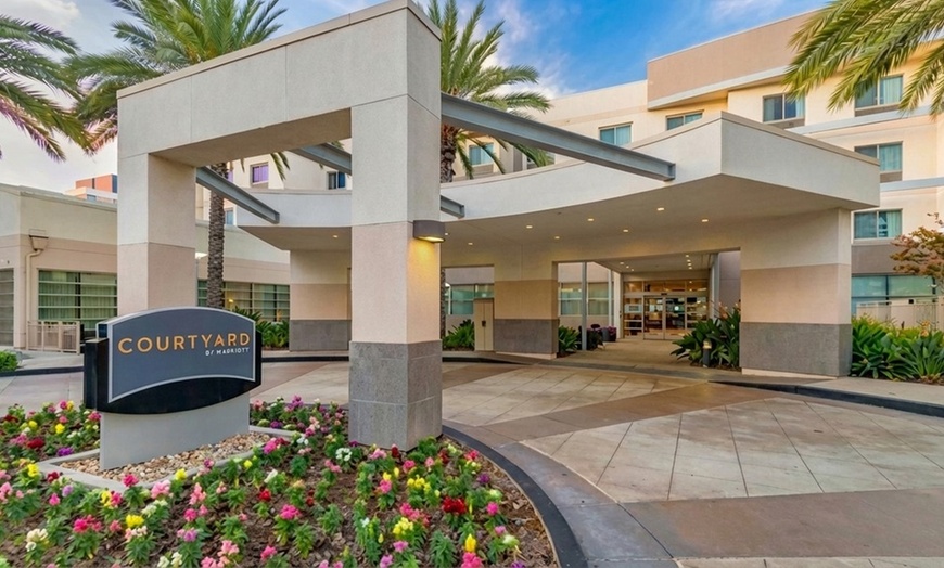 Image 10: Courtyard-Style Hotel Retreat with Outdoor Pool & Bistro Dining