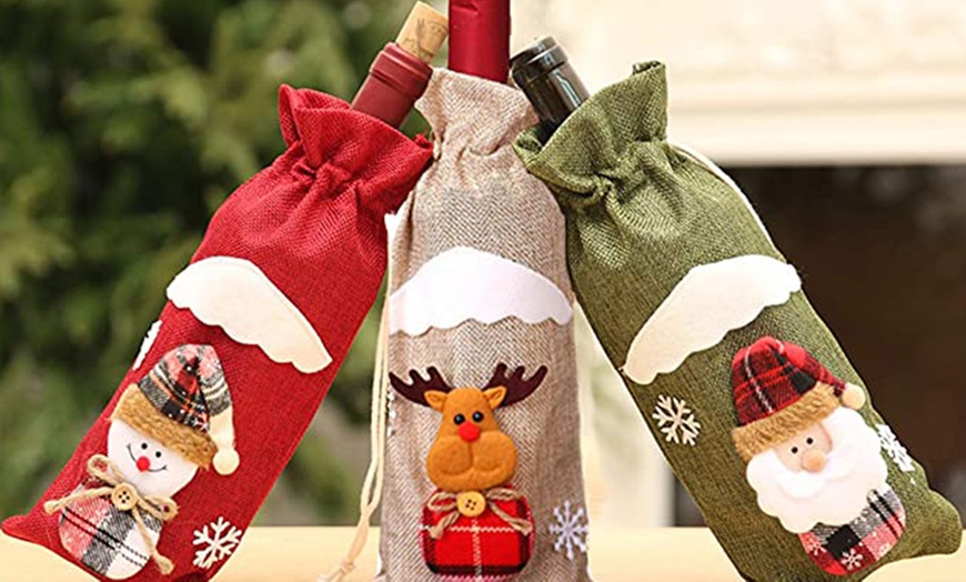 Image 1: One, Two or Four Christmas Wine Bottle Cover Bags