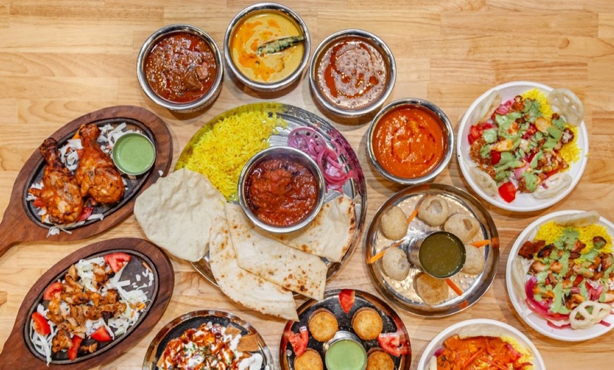 Image 1: Get $50–$150 Toward Food & Drinks at Me & Yogi Indian Kitchen
