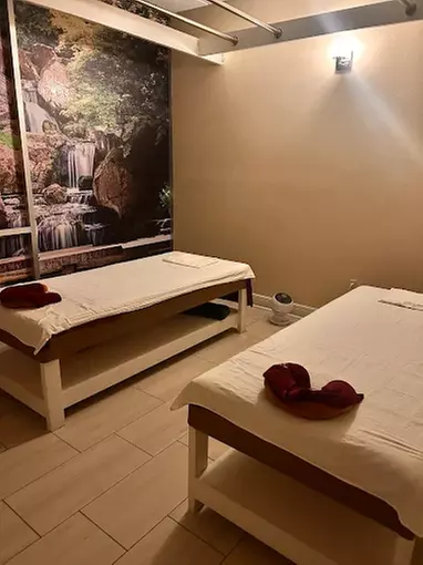 Couples 60-Minute Deluxe Body Massage with Essential Oils & Hot Stones