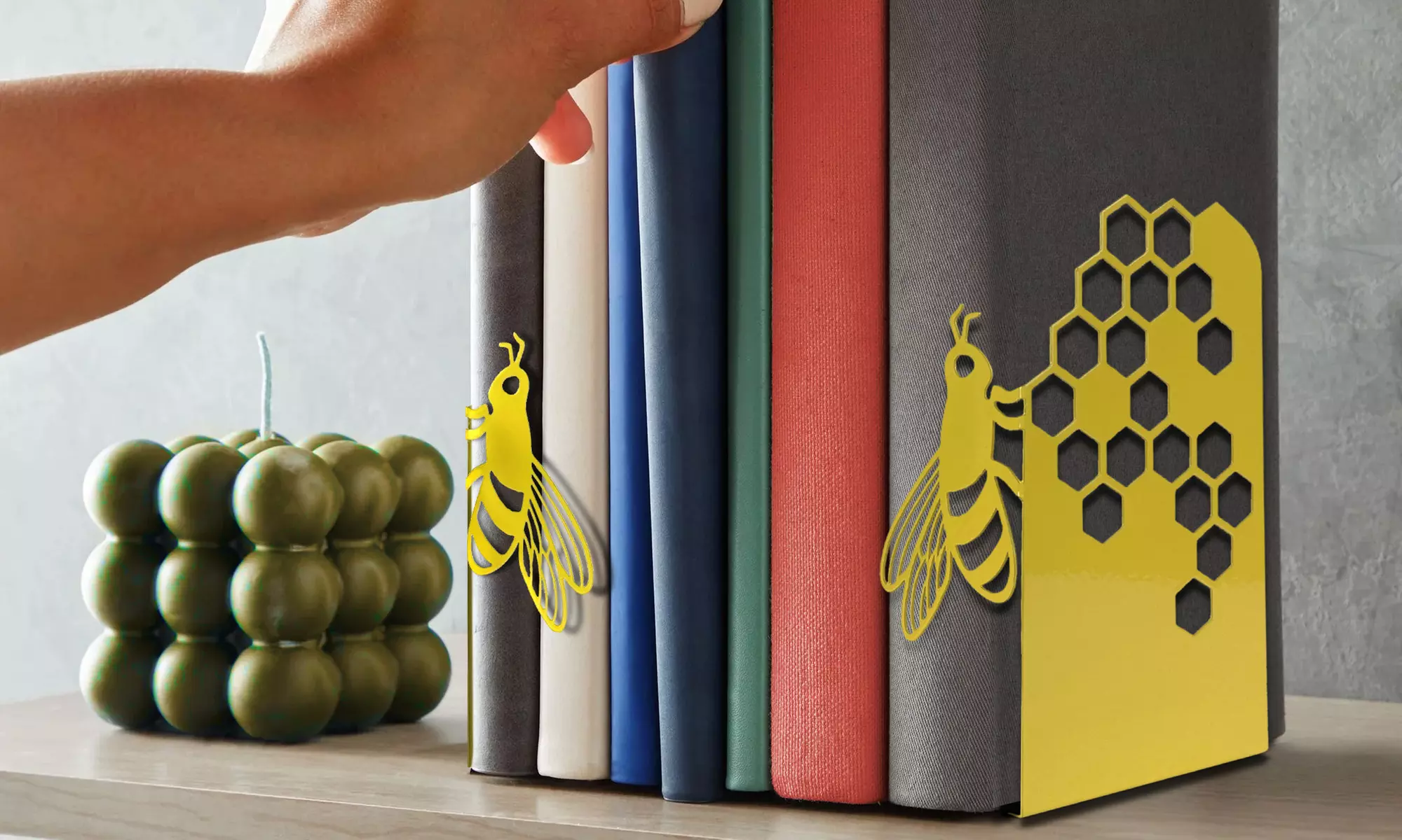 Coppia di fermalibri da mensola