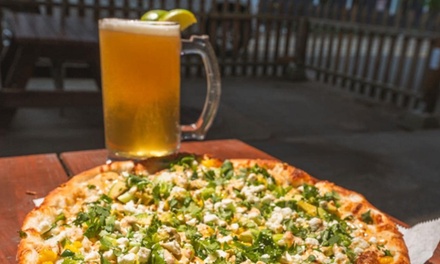 Any Medium Specialty Pizza or Build Your Own Pizza with Up to Three Toppings - Schmizza Pub & Grub