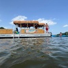 Image 1: Scenic Private Tiki Boat Cruise with Captain for Big or Small Groups