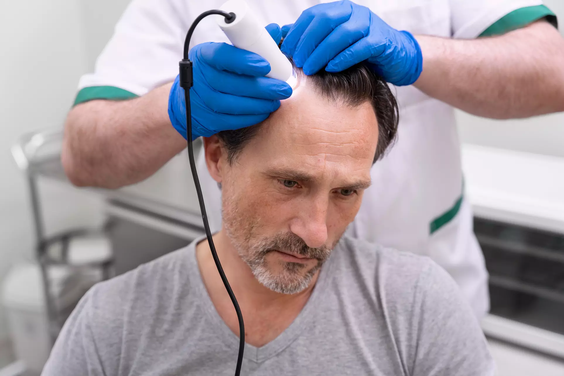 (Up to 55% Off) Laser Hair Restoration Consultation + Optional Treatment Sessions or ROST Scalp Therapy - Second Medium