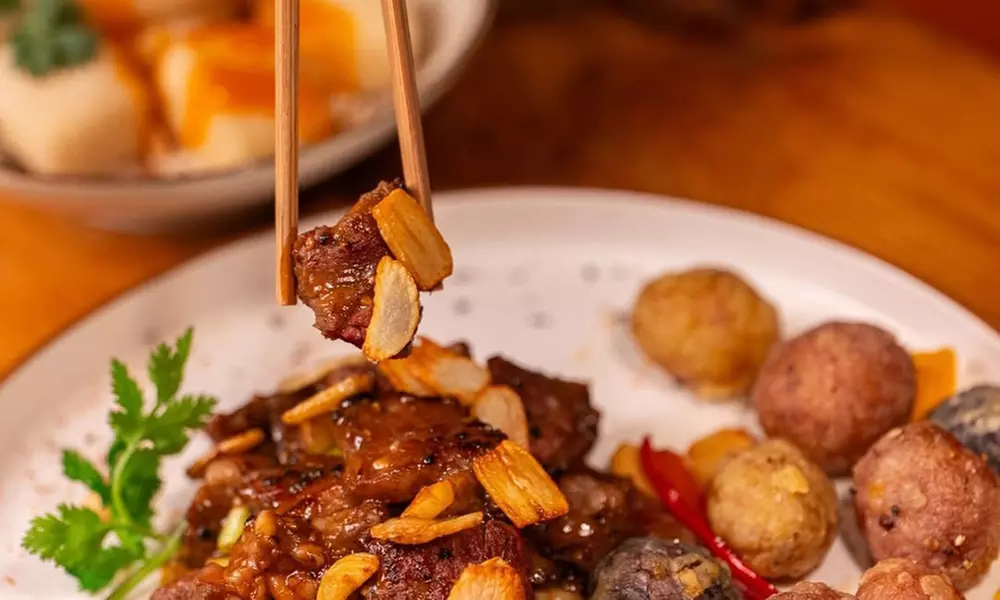 Savor $50 Dining Credit or Dinner with Cocktails for Two or Four