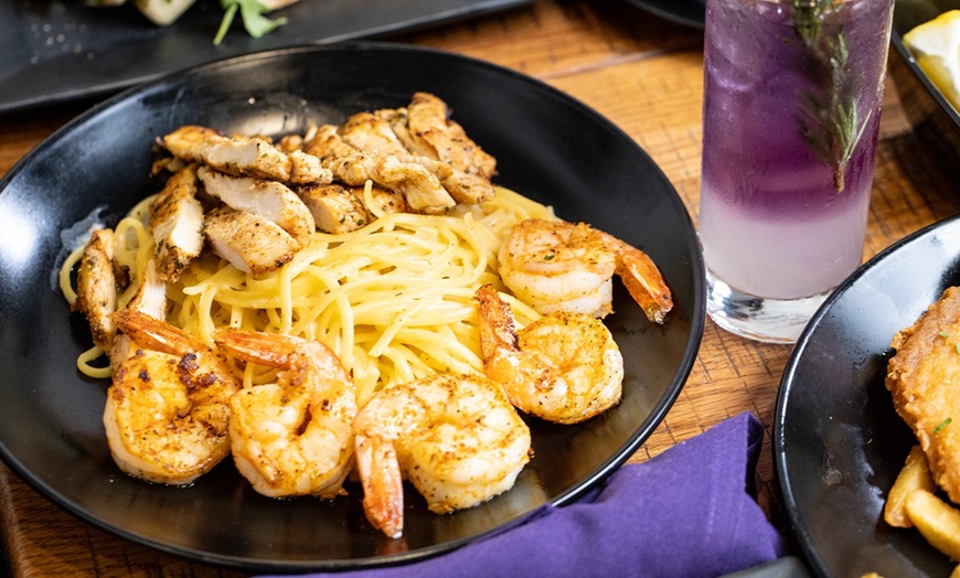 Image 4: Dinner for Two or Four with Cocktails or $50 or $100 Dining Credit