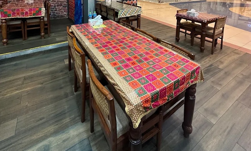 Image 9: Voucher Worth AED 100 or AED 150 to Spend on Anything Off the Menu 