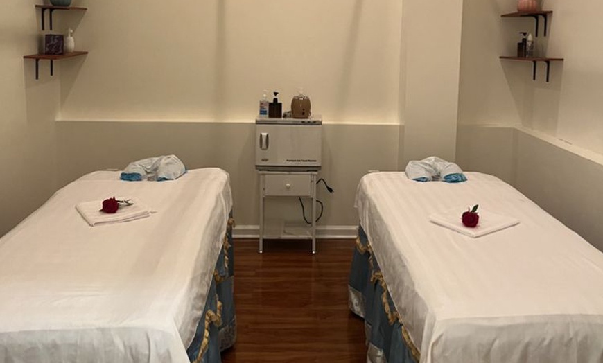 Image 2: Swedish or Deep Tissue Massages for 1 or 2 with Optional Hot Stones 