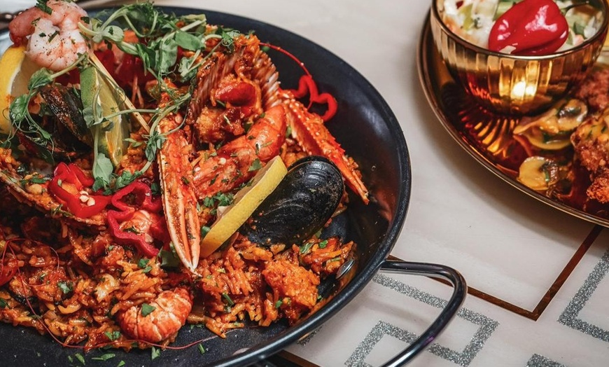 Image 3: Seafood or Chicken Paella with Sangria for Two or Four at Tarantino's 
