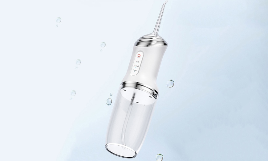 Image 10: Three Modes Electric Cordless Water Flosser for Teeth
