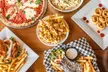 $50, $75, or $100 Dining Credit | Dozen Wings, Fries, Entrees, Dessert, & Soft Drinks for 1 or 2 (Up to 51% Off) - Second Medium