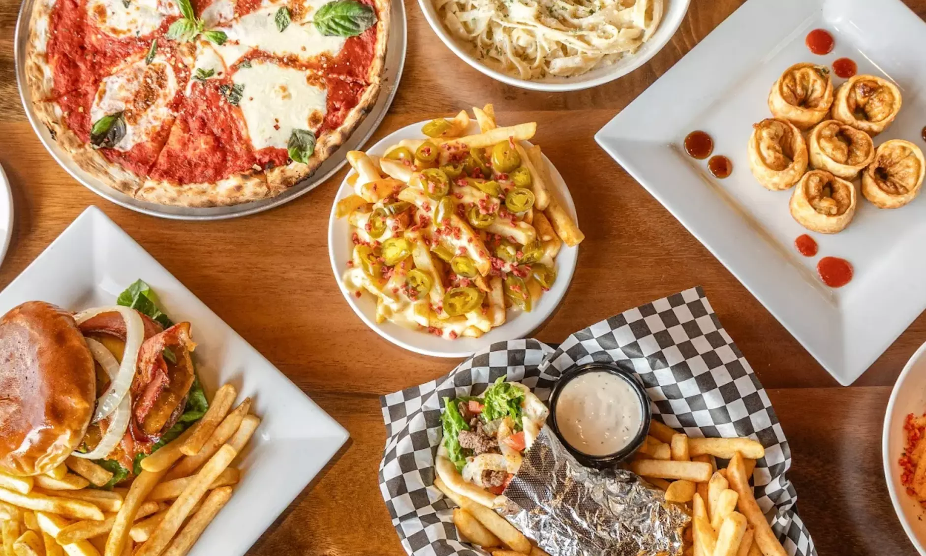 $50, $75, or $100 Dining Credit | Dozen Wings, Fries, Entrees, & More