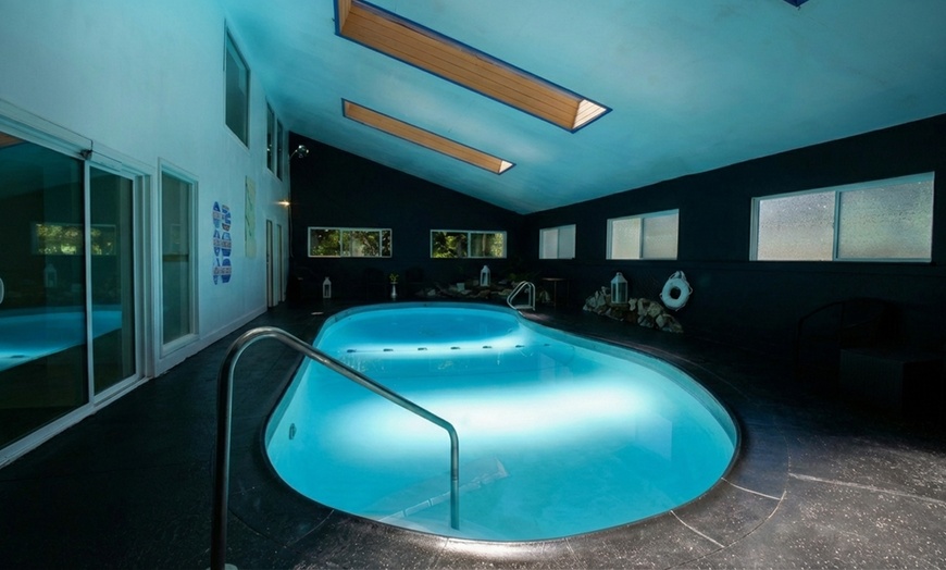 Image 14: Relax by the pool with lake views and mountain breezes