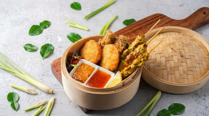 A spread of delicious Thai dishes including noodles, curries, and rice, ready for an all-you-can-eat feast at Go Thai.