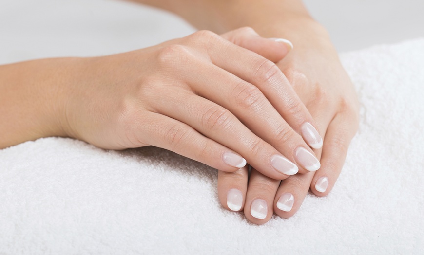 Image 1: Basic or Deluxe Manicure and Pedicure with Foot Massage 
