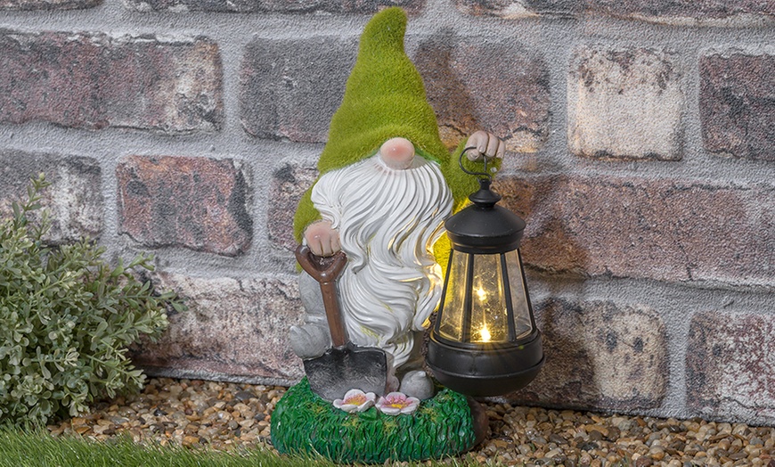 Image 2: One or Two Solar Lantern Flocked Garden Gnomes