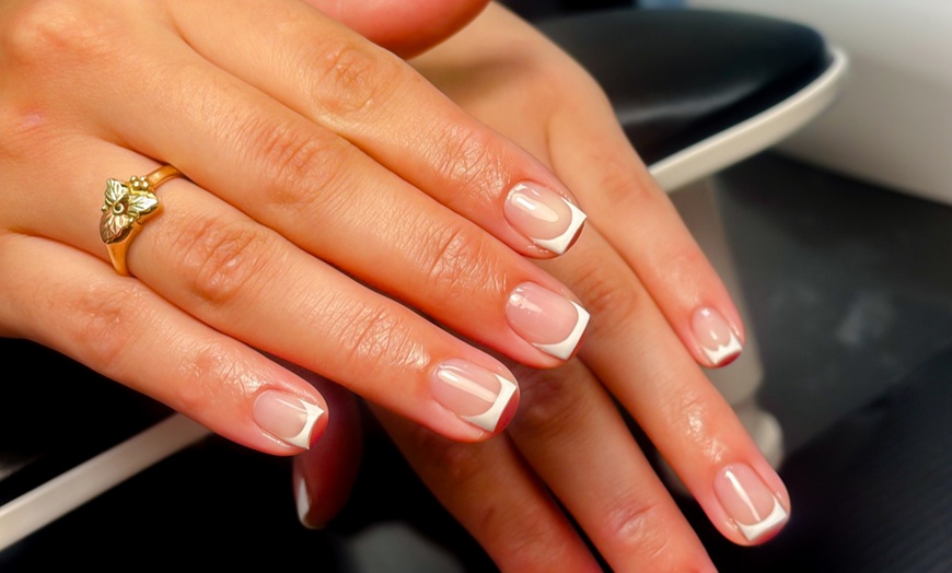 Image 4: Experience Awaits: French Gel Manicure and Deluxe Gel Pedicure Combo