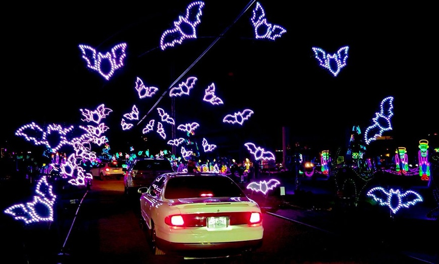 Image 2: Enchanted Lights: A Mile-Long Halloween Themed Drive-Thru Light Show