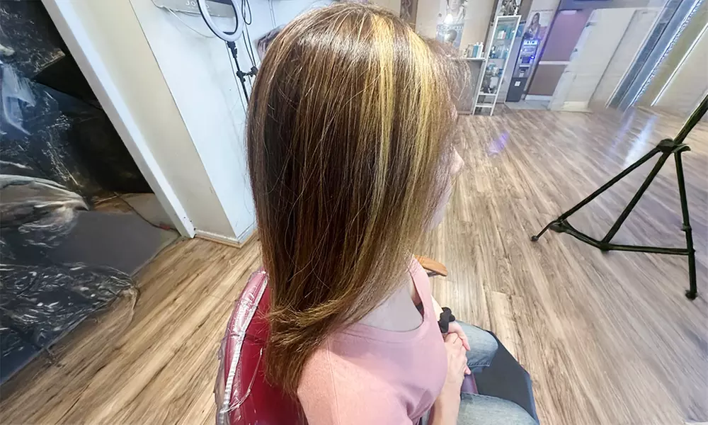 One or Two Magic Sleet Hair Treatments with Optional Haircut at World Beauty Center (Up to 55% Off) - Primary Image