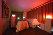One 50-Minute Couples Massage for Two or Couples Package with Massage and Facial for Two. Save Up to 60% - Second Medium