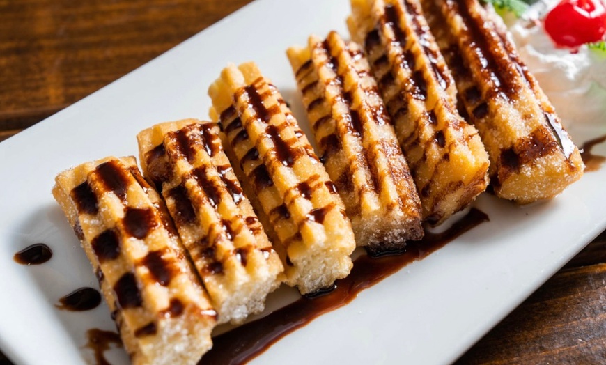 Image 24: Vibrant Rooftop Dining: Choose Meals, Margaritas, or Dining Credit